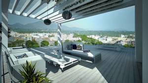 Una moderna terraza al aire libre con muebles con estilo y decoración de jardín, con vistas a un pueblo pintoresco y montañas en la lejanía.