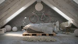 Un dormitorio abuhardillado moderno diseñado con una estética minimalista que presenta una estructura de cama con paleta, ropa de cama neutra, una bicicleta colgada, accesorios de iluminación geométricos y un estilo con una mezcla de texturas que incluyen una pared de ladrillos y una manta de piel.